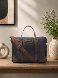 Laptop shoulder bag with sturdy handles, adjustable strap and spacious compartments, ideal for office, travel and everyday use.