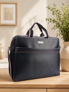 Stylish multipurpose bag with top handles and adjustable shoulder strap, designed for convenient carrying during travel, work and daily use.