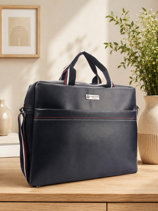 Stylish multipurpose bag with top handles and adjustable shoulder strap, designed for convenient carrying during travel, work and daily use.