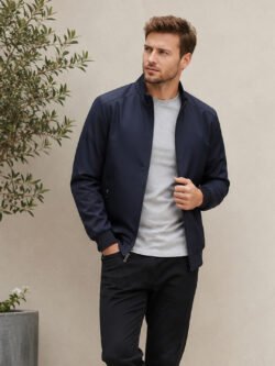 Men's lightweight casual jacket with full zip closure, stand collar, ribbed cuffs, and practical side pockets.