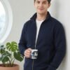 Modern men's jacket featuring a full front zip, stand collar, ribbed cuffs, side pockets, and relaxed casual styling.