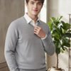 Oswal Wool Grey Men's black wool sweater layered over a white collared shirt for stylish winter wear.
