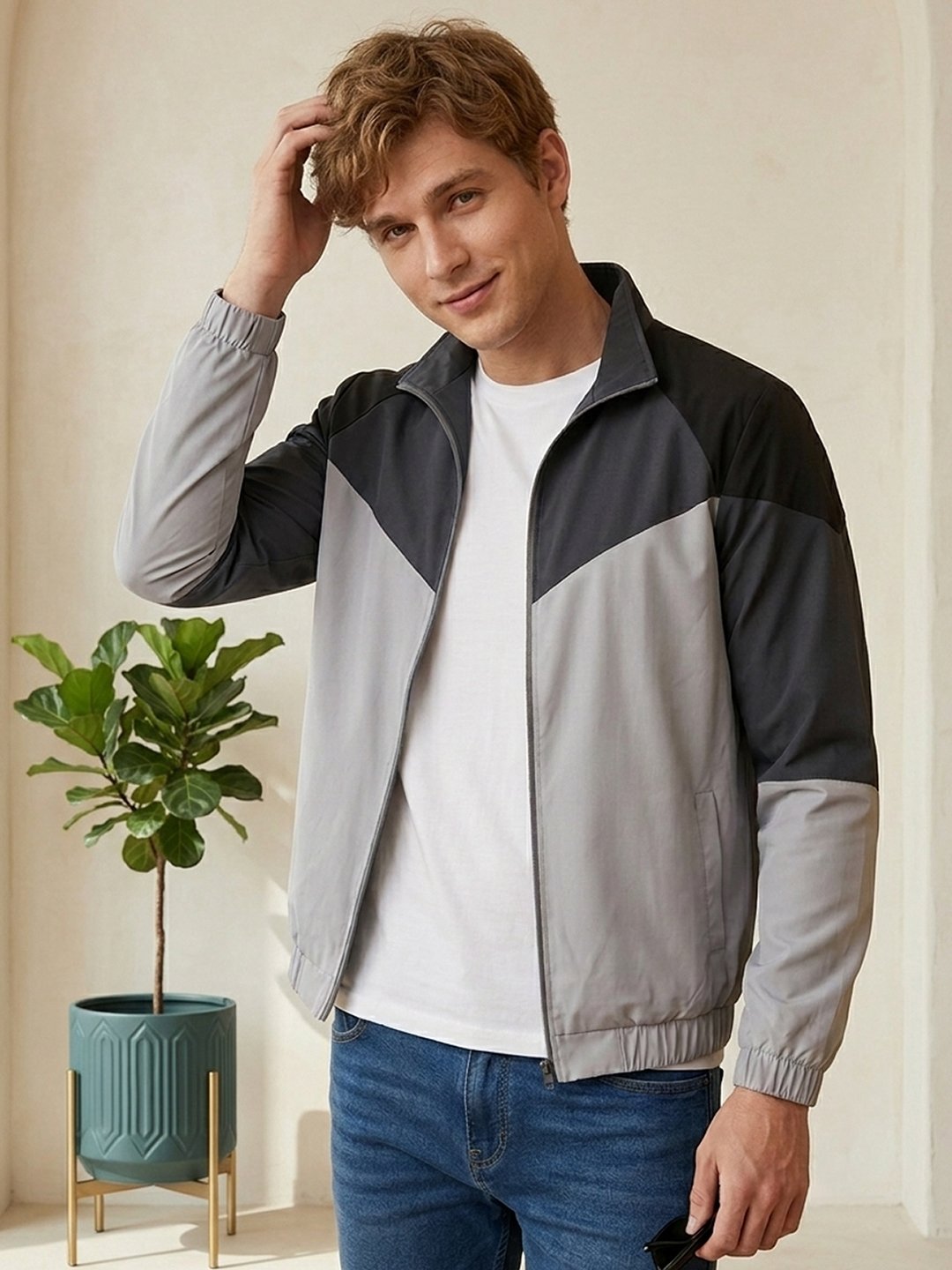 Men’s zip-up jacket with a stand collar, ribbed cuffs, side pockets, and versatile design suitable for everyday casual outfits.