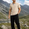 Desert Sand Men’s polo T-shirt styled with dark trousers and sunglasses in a scenic outdoor setting, perfect for a relaxed casual look.